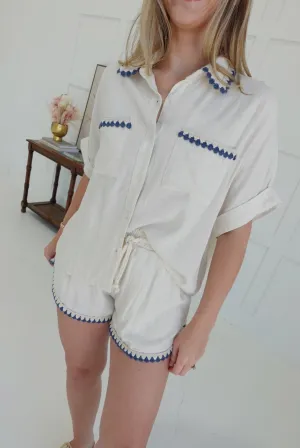 White Cap Embroidered Hem Shorts
